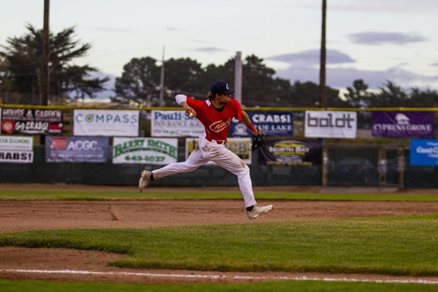 Crabs infielder David Morgan (#20) makes a play on a ground ball at third base on June 12, 2021 while facing Seals Baseball at Arcata Ballpark. - THOMAS LAL