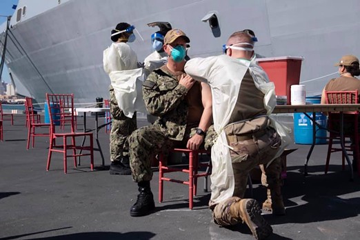 Vaccinations were given pierside to the USS San Diego’s crew and embarked Marines in March. - U.S. NAVY