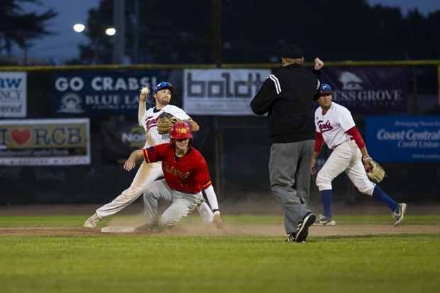 Crabs shortstop Aaron Casillas throws the ball over to first base after making the play at second for an out while facing the Alaska Goldpanners on Aug. 4, 2021 at Arcata Ballpark. - THOMAS LAL