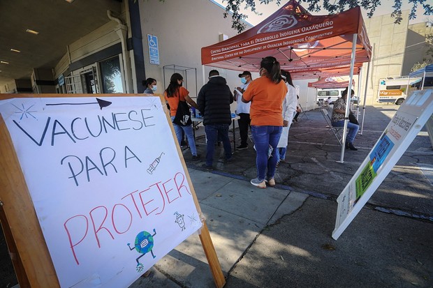 Centro Binacional para el Desarrollo Indigena Qaxaqueno (CBDIO) organized and ran a vaccination drive outside their Tulare Street offices in Fresno on Oct. 9, 2021. - ALEX HORVATH FOR CALMATTERS
