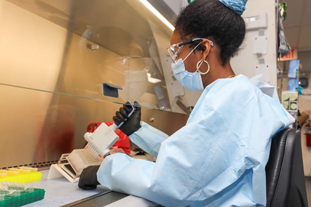 Humboldt County Public Health Microbiologist Annayal Yikum prepares patient samples for the COVID-19 testing process. - SUBMITTED