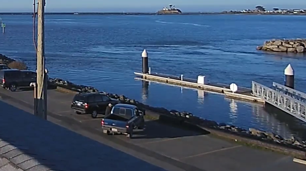 Screen shot from the Crescent City Harbor cam showing surges on Jan. 15. - NWS