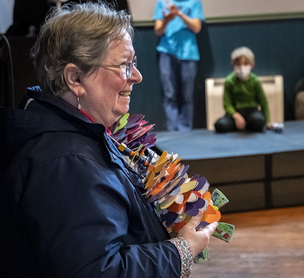 Libby Maynard was presented with this large hand-made necklace and flower bouquets in recognition of her 42 years as executive director of the Ink People. - PHOTO BY MARK LARSON
