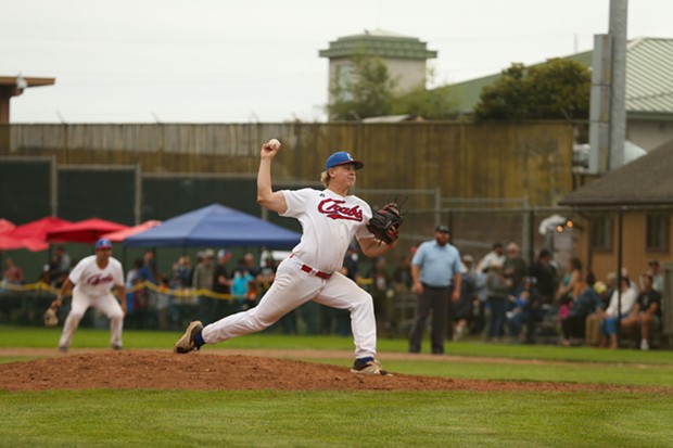 Crabs pitcher and Eureka local Garrison Finck throws a pitch in the last inning of the season on Aug. 7 at Arcata Ballpark. - THOMAS LAL