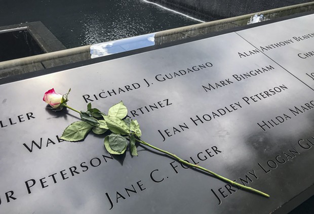 A single rose sits by Richard Guadagno's name at the 9/11 Memorial in New York City in 2019. - PHOTO BY MARK LARSON