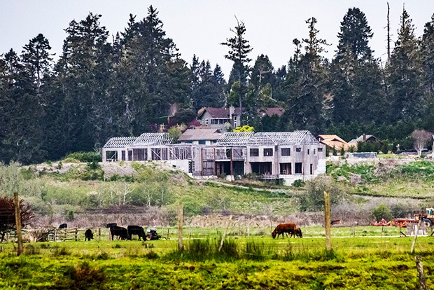 The partially constructed Schneider mansion, as it has sat since the county issued a stop-work order in December of 2021. - PHOTO BY MARK LARSON