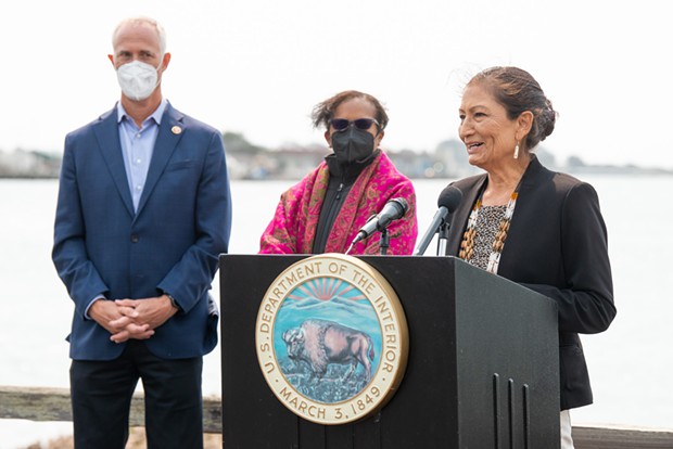Flanked by Congressman Jared Huffman and Council on Environmental Quality Chair Brenda Mallory, U.S. Secretary of the Interior Deb Haaland speaks at a press conference about offshore wind power at the Woodley Island Marina. - MARK MCKENNA