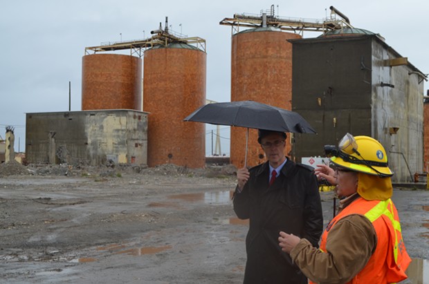 Jared Huffman speaks with an EPA representative under more literal rain at the Samoa Pulp Mill last year. - GRANT SCOTT-GOFORTH