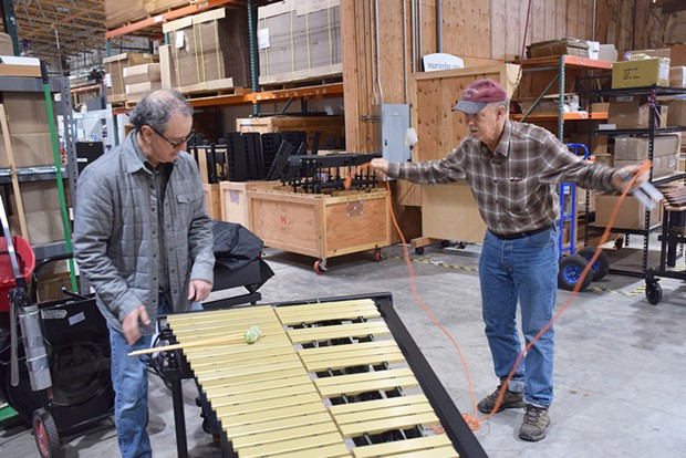 Marimba One founder Ron Samuels readies a vibraphone headed for Fortuna High School for a demonstration as consulting engineer Steve Cole plugs it in. - PHOTO BY THADEUS GREENSON