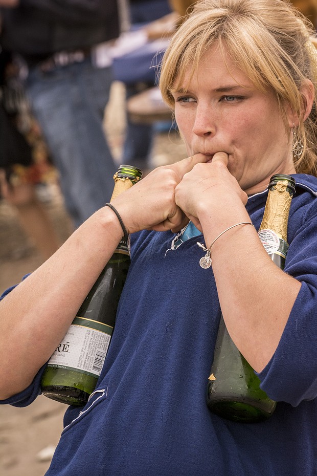 Long-time volunteer and self-described "jack-of-all trades" Libby Tonning, of Manila, provided a loud whistle while serving champagne prior to the Golden Rule's launching at the Zerlang & Zerlang boat yard on the Samoa peninsula. - MARK LARSON