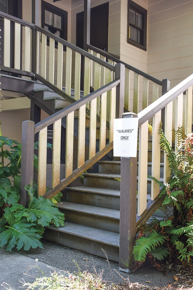 A sign outside the Communications department, whose main floor is accessible only by stairs, declares the building as being for "walkies only." - PHOTO BY THADEUS GREENSON