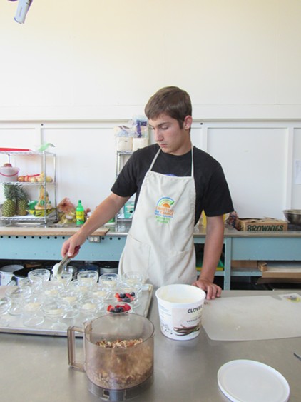 Local high-schooler John Georgia volunteers for the program, earning his food handlers certificate. - LINDA STANSBERRY