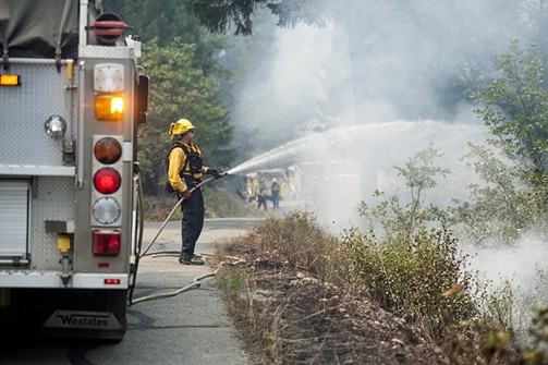 Firefighter at the Mad River fire. - MARK MCKENNA