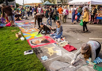 Pastel artists hard at work on the plaza sidewalks. - MARK LARSON