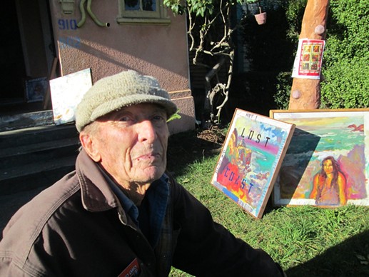 Otto in his yard among his paintings last winter. - JACK SEWELL