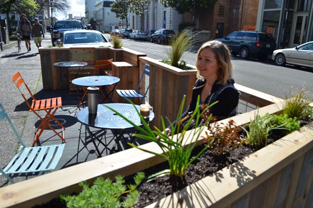 Jessica Cenotti sips on a coffee in the parklet outside Ramone's on a rare sunny February afternoon. - GRANT SCOTT-GOFORTH