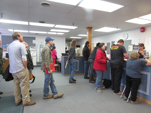 The first applicants of the day wait in line to submit their applications at the County Planning Department. - LINDA STANSBERRY