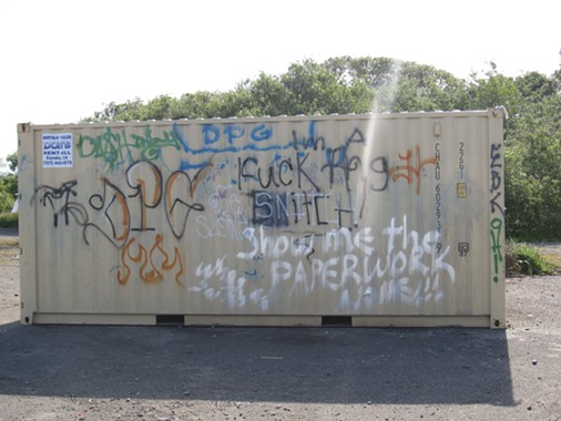 A graffiti-ed dumpster. - LINDA STANSBERRY