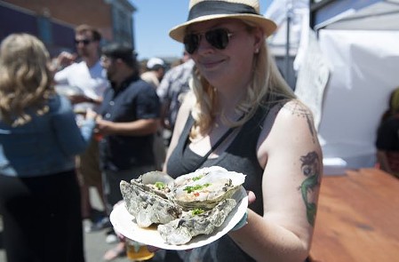 Shelling out the good stuff at the 26th annual Arcata Bay Oyster Festival. - MARK MCKENNA