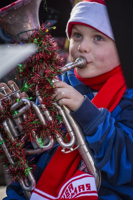 Jude Carter, 6, of Eureka, played in his fourth TubaChristmas performance, along with his father and grandmother, in front of a crowd of 100 or more at the Gazebo in Old Town Eureka on Saturday, Dec. 3 - MARK LARSON