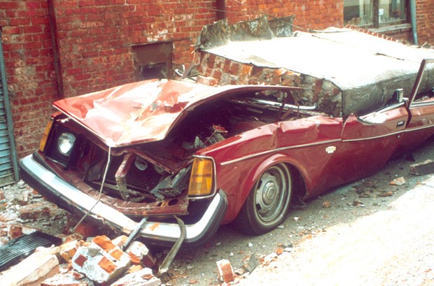 A brick wall crushes a car in Ferndale. - COURTESY OF REDWOOD COAST TSUNAMI WORKING GROUP
