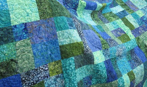 “Splash,” the queen-sized Opportunity Quilt to be raffled off at the Heart of the Redwoods Quilt Show. - PHOTO BY CAROL HARRISON