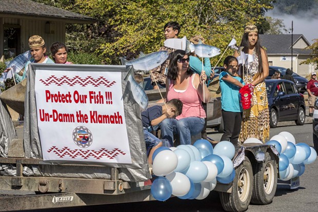 Participants representing the Yurok Tribe Social Services Department advocated for salmon and dam removal and tossed candy to the crowd from their parade float at the 2016 Klamath Salmon Festival. - MARK LARSON