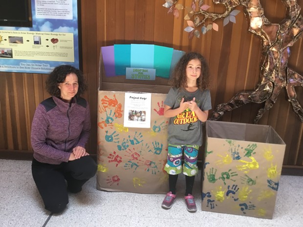 Amy Tetzlaff and her daughter Iris place donation boxes for stuffed animals in Arcata City Hall. The huggable toys will be sent to immigrant children in "tender age" shelters. - PHOTO COURTESY OF MAUREEN MCGARRY