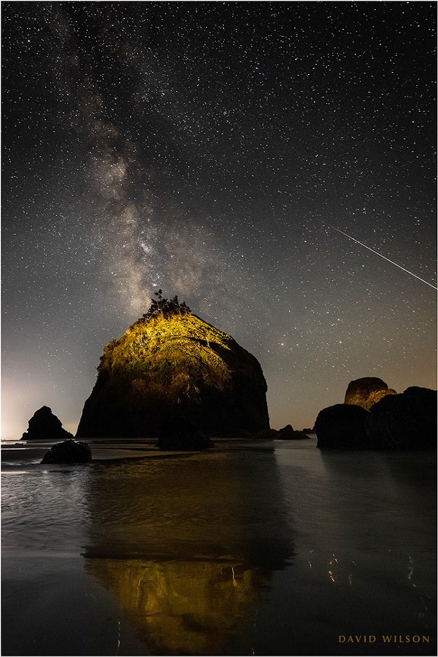 The one that got away. A large meteor streaks off the edge of the frame off the coast of Houda Beach. I had it by the tail! The truth of the matter is that this is cropped in from the left edge; for some reason I had the great rock centered. If I had composed it the way I knew I should have at the time, the entire meteor would have been included. This is why my hair is gray. Sept. 10, 2021, in Humboldt County, California.