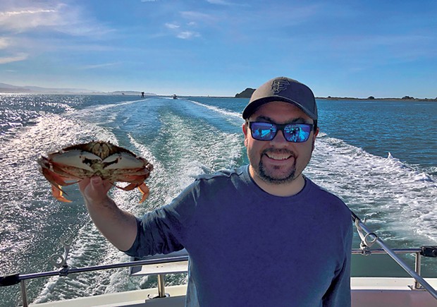 Eureka resident Joey Sullivan holds a nice Dungeness crab caught aboard the Reel Steel on Sunday.
