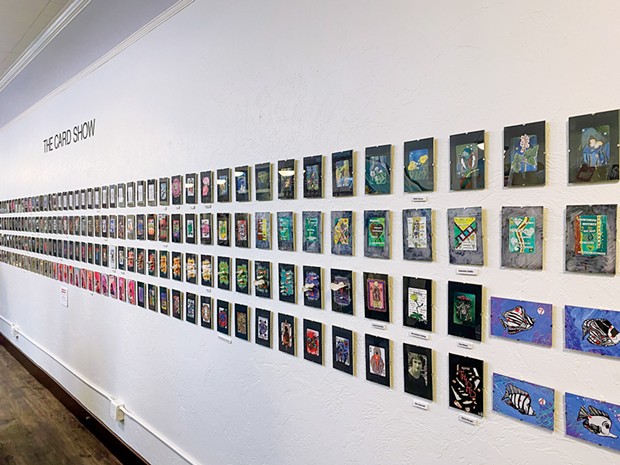 The wall of more than 270 cards on display for The Card Show at Epitome Gallery.