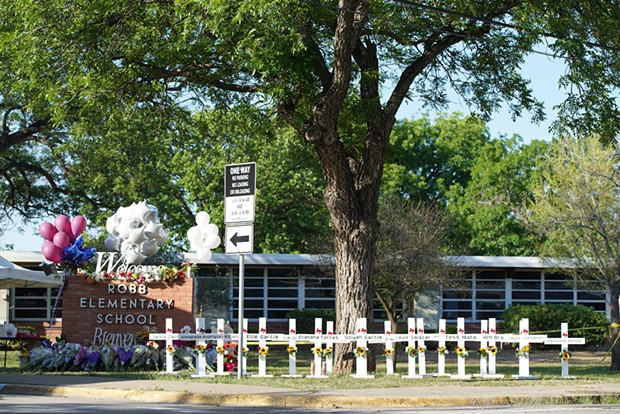 At Robb Elementary School in Uvalde, Texas, crosses memorialize victims of the May 24 shooting, where an 18 year old killed 19 students and two teachers with a legally purchased AR-15-style rifle.