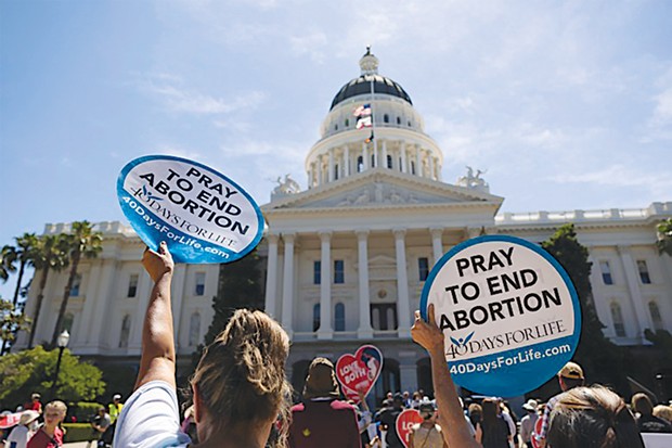 Anti-abortion protesters gathered at the state Capitol against abortion measures before the Legislature on June 22, 2022.