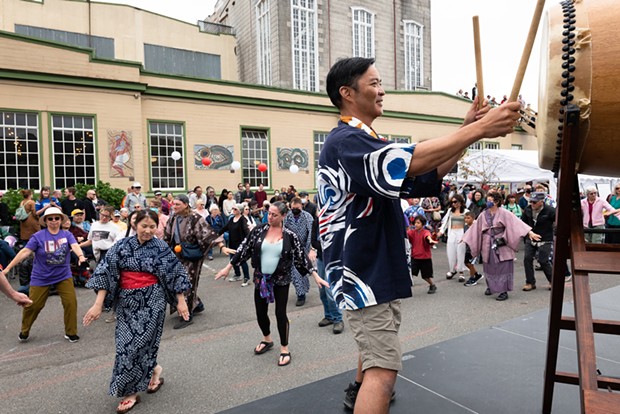 Franco Imperial, visiting from San Jose Taiko, beats the big taiko as the bon odori dancers circle the stage in front of the Arcata Playhouse on Sunday, Aug. 14.