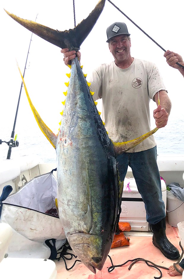 John Neill of Shelter Cove poses with his huge 151-pound Yellowfin tuna he landed Sunday while trolling for albacore at Vizcaino Knoll out of Shelter Cove.