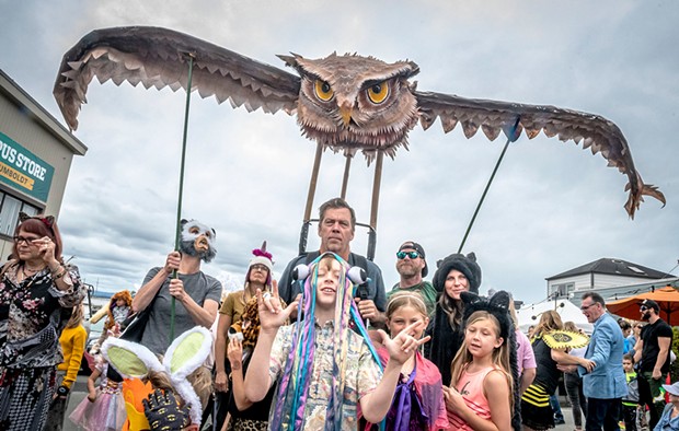 A last-minute shopping trip replaced the forgotten-at-home wing supports and this owl finally soared over Saturday's All Species Parade during the North Country Fair.