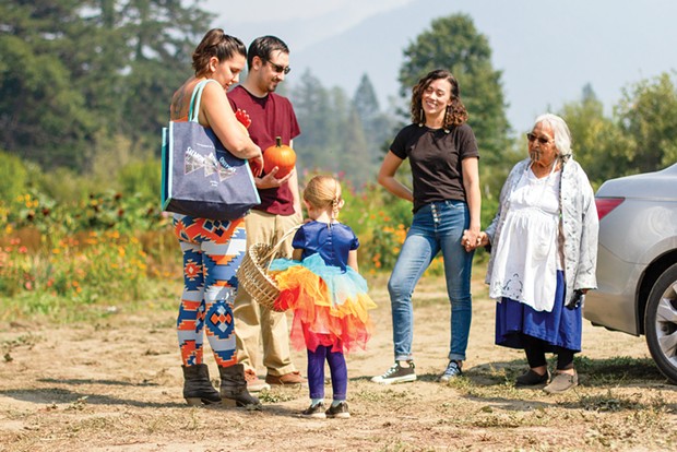 Three of four generations gathered to harvest pumpkins at Tishannik Garden. From left: Adia Supahan, her husband, Luke Supahan, and their daughter, Shasti Supahan, met up with Elly O'Rourke and her Atish (or grandmother), Jeanerette Jacups-Johnny.