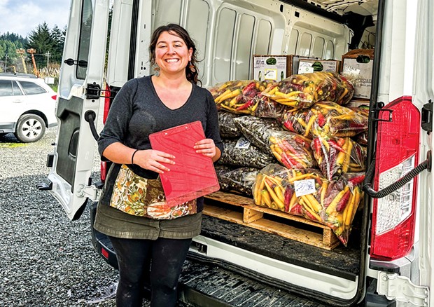 Harvest Hub Coordinator Hailee Nolte packs up the van to make deliveries.