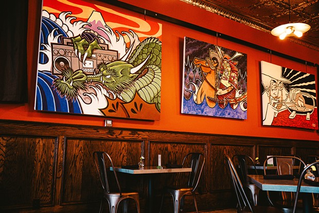 Sonny Wong's paintings on the Diver Bar &amp; Grill's walls.