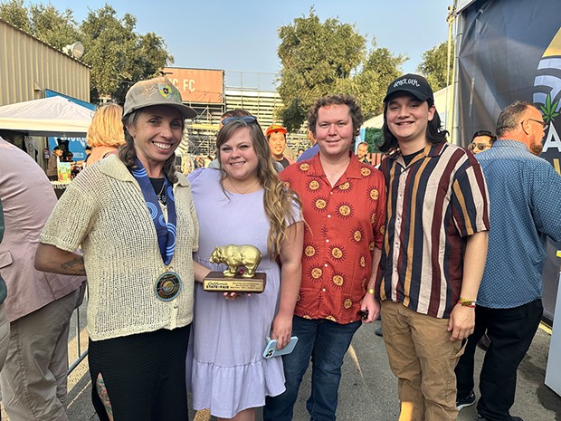 Wendy Baker, Sierra Martinez, Erik Nichols and Joshua Mancilla of Space Gem with their Golden Bear award at the California State Fair.