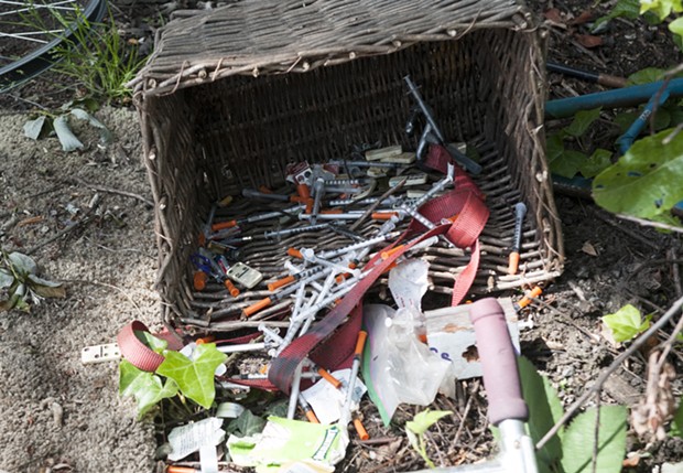 Needles discarded in a homeless camp.