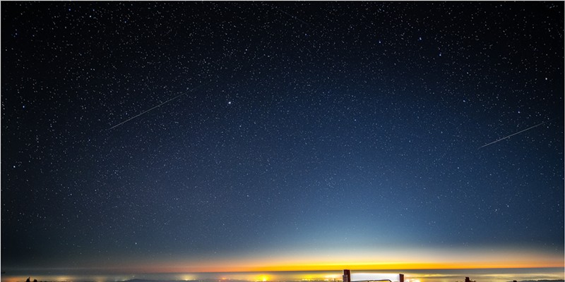 “Self Portrait with Perseid Meteors.” The lights of Eureka shine on the Pacific Coast beneath a pair of Perseid meteors in this composite of two images from a timelapse sequence taken during the Perseid meteor shower of 2020 from the hills of Humboldt County on Aug. 12.