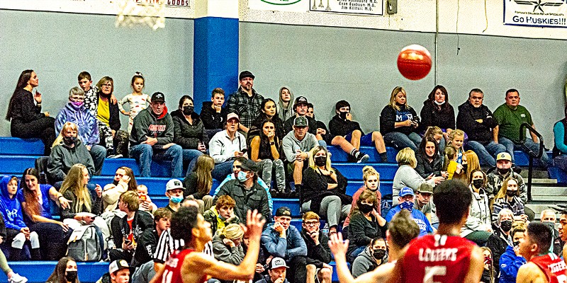 Mostly unmasked spectators take in a recent Fortuna boys basketball game.