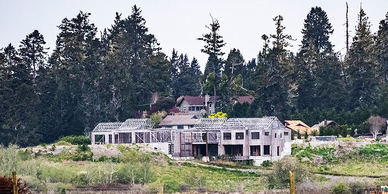 The partially constructed Schneider mansion, as it has sat since the county issued a stop-work order in December of 2021.