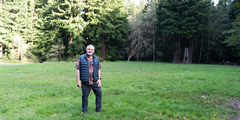Sacred Groves founder Michael Furniss, who is working to bring a conservation burial option to Humboldt County, in a meadow encircled by trees at Redwood Park.