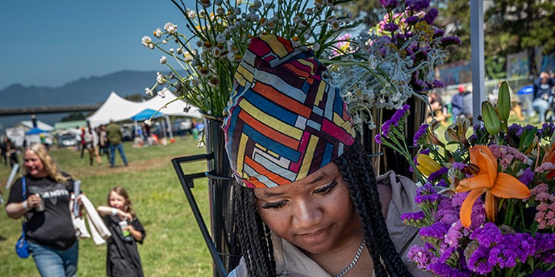 Juneteenth 2024 A large crowd entered Halvorsen Park in Eureka on Saturday to enjoy the fifth annual Juneteenth Celebration organized by Black Humboldt (founded in 2018). The event included wide mix of food, educational and family-friendly activity booths, including a stop for free flower bouquets. Photo by Mark Larson