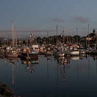 Woodley Island Walkabout Slideshow A walk along the Woodley Island Marina after sunset reveals Alan Workman's sailboat, Belle France, with its holiday lighting and a good view of the Carson Mansion across the bay. Photo by Mark A. Larson