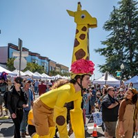 North Country Fair 2024 This giraffe was one of several stilt walkers in the All Species Parade. Photo by Mark Larson