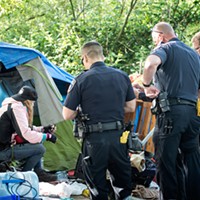 'A Place That Absorbs Lost Souls' Eureka police officers talk with a woman who remained in the marsh after the May 2 deadline. She ultimately packed some of her belongings and left, at which point police dismantled the remnants of her camp.