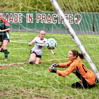 Athena Miller, striker with the Eureka Loggers, watches her kicked ball go into the nets for a goal as Arcata Tiger goalie Sophia Belton stretches out in dismay.
